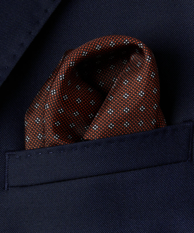 Pañuelo de bolsillo con motivo floral de cuatro puntos en naranja intenso y blanco